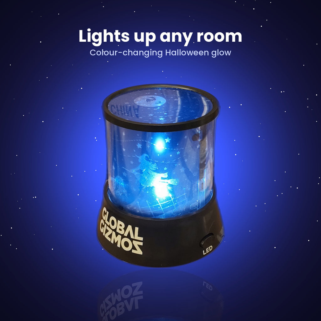 Halloween projector lamp glowing blue in a dark room, colour-changing night light